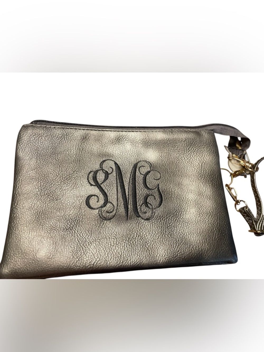 Cute tassel Monogram M Metallic Leather Crossbody. 6 width 9 inches length.